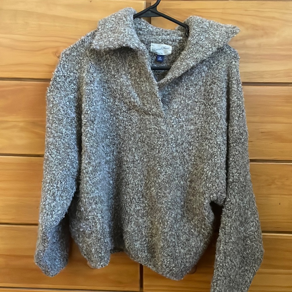 Size small universal threat sweater
